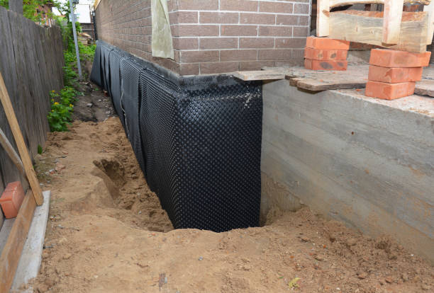 SJ Waterproofing Pros technician performing targeted Interior Drainage System assessment in Independence, OR